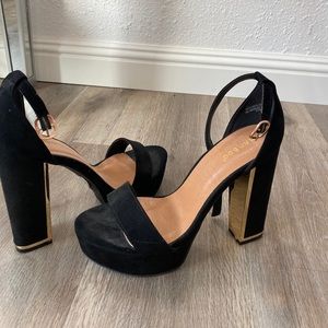 Black and gold heels